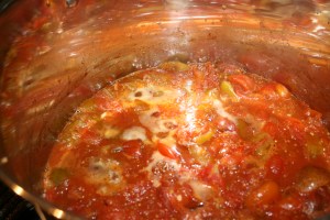 Tomatoes simmering into salsa